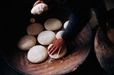Low section of person with vegetables on table