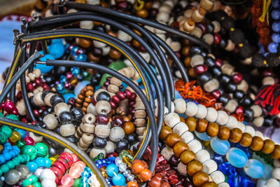 Close-up of multi colored jewelry for sale in market