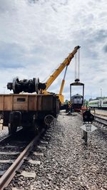 Train at construction site against sky