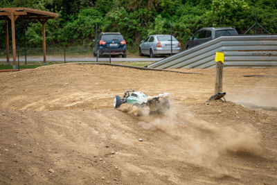 Car working on dirt road