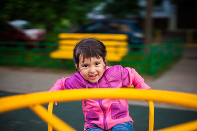 Portrait of smiling girl in playground