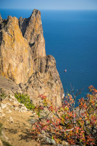 Sheer cliffs near the sea of the volcanic formation karadag in koktebel crimea