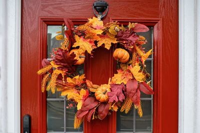 Picture of an autumn coloured halloween decoration on an exterior door