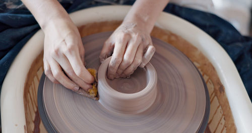 Midsection of person working in workshop