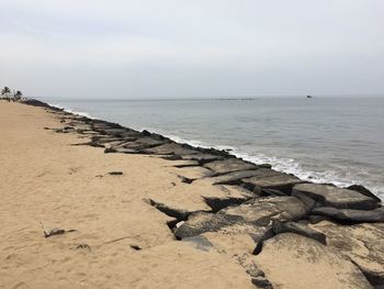 View of calm beach against the sky