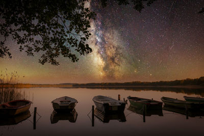 Scenic view of lake against sky at night
