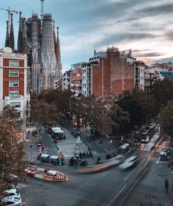 High angle view of city street and buildings against sky