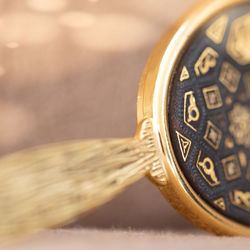 Close-up of hand mirror on table