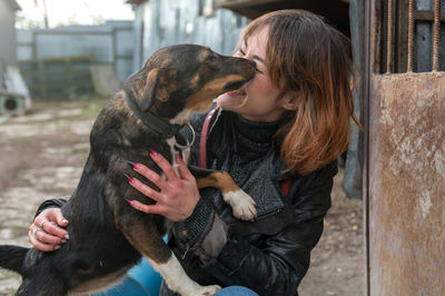 Dog at the shelter. animal shelter volunteer takes care of dogs. lonely dogs in cage