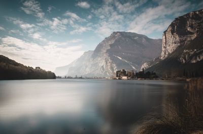Scenic view of lake and mountains against sky