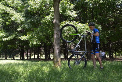 Boy cycling in park