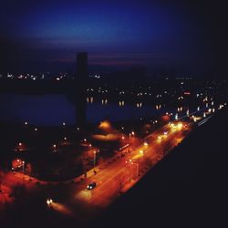 High angle view of light trails on road at night