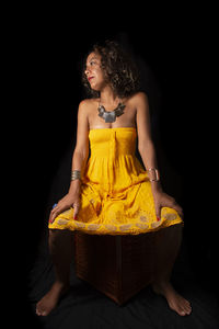 Afro-brazilian model portrait in studio with black background. salvador bahia brazil.