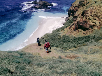 High angle view of people on sea shore