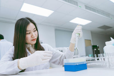 Scientist holding test tube at laboratory