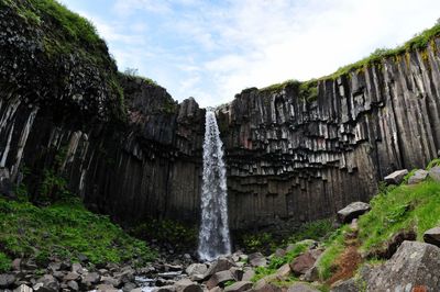 View of waterfall on rock face