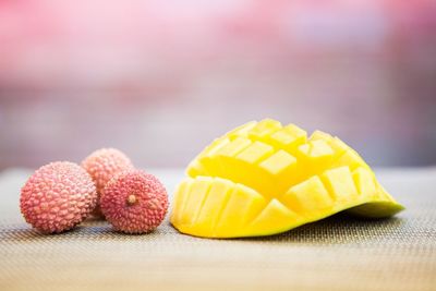 Mango and lychee on table