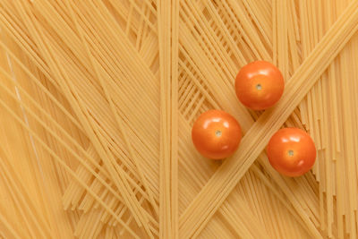 Close-up of spaghetti and tomatoes, full frame