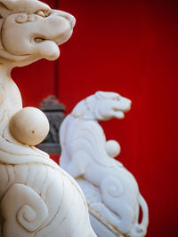 Close-up of buddha statue against temple