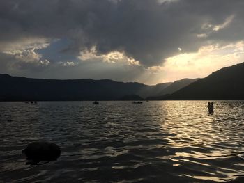 Scenic view of lake against sky during sunset