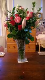 Flower vase on table at home