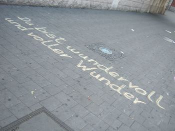 High angle view of text on street