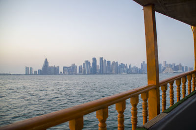 The view of doha's architecture / buildings from the dhow in the middle of the sea in qatar