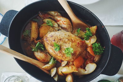 Directly above shot of roasted chicken in casserole