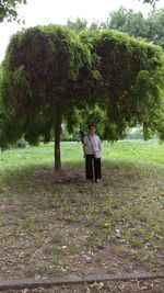 Couple standing on field