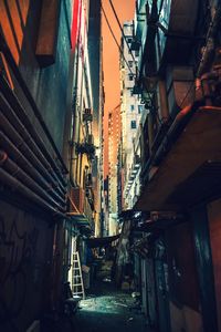 Low angle view of alley in city