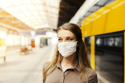 Portrait of woman at railroad station