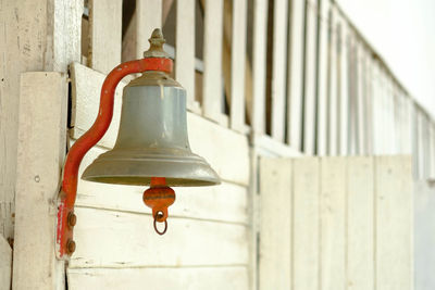 Close-up of lamp mounted on wall