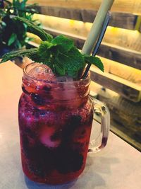 Close-up of drink in glass jar on table
