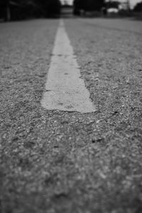 Close-up of arrow symbol on road