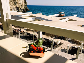 High angle view of fruits on table against sea