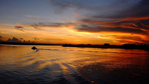 Scenic view of sea at sunset