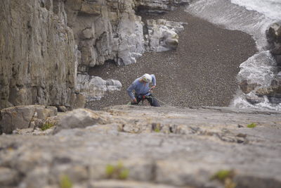 Man working on rock