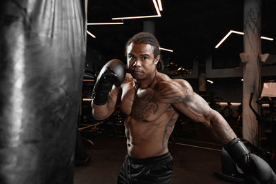 Portrait of man exercising in gym