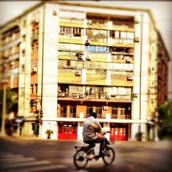 Man riding bicycle on street