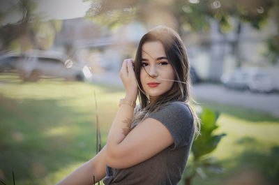 Portrait of beautiful woman standing outdoors