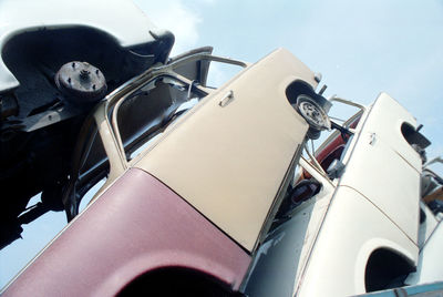 Low angle view of vintage car against sky