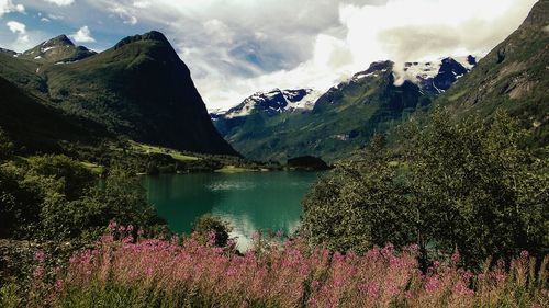 Scenic view of lake with mountains in background