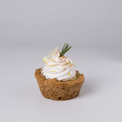 Close-up of cake against white background