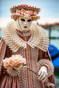 Woman wearing costume and mask during venice carnival