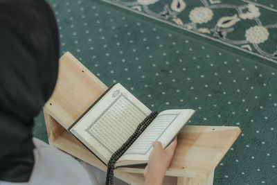 High angle view of woman praying