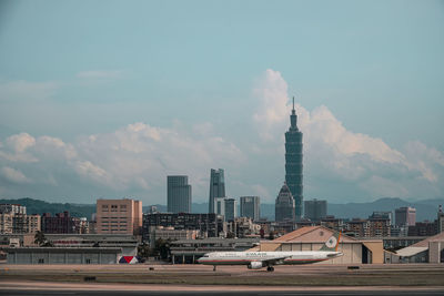 View of buildings against cloudy sky