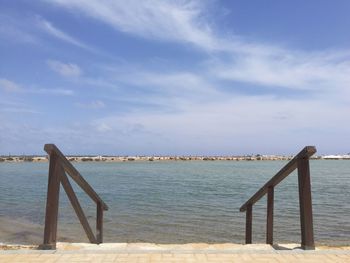 Pier over sea against sky