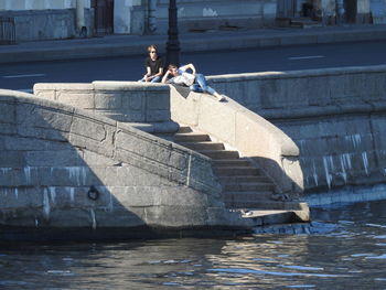 Woman sitting on a boat in sea