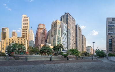 Buildings in city against sky