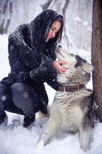 Woman with ice cream in snow